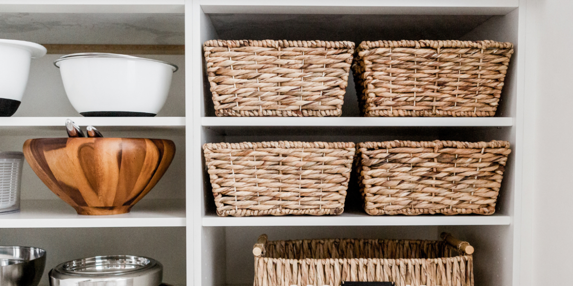 storage baskets for organizing and bowls on a shelf