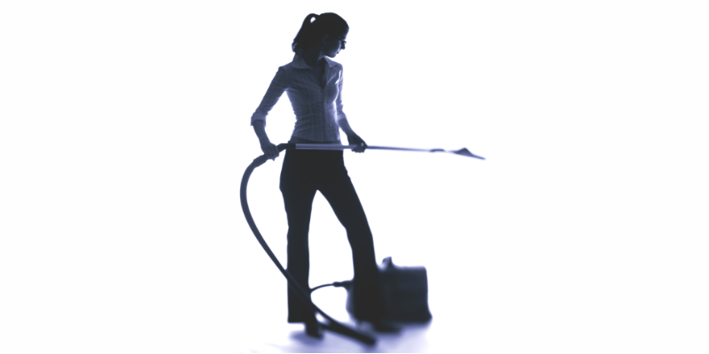 what to expect from a house cleaner, cleaning lady holding a hoover .