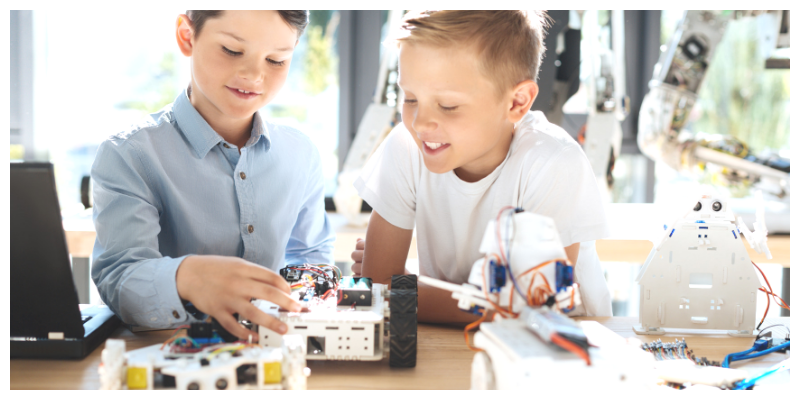 Two boys building a robot . Pros and cons of ADHD medication.