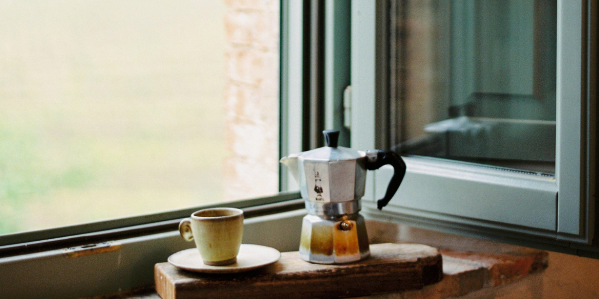 open window with coffee pot