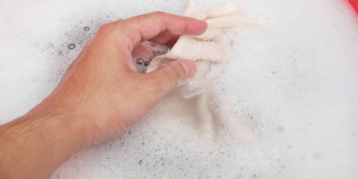 handwashing garment in hot soapy water