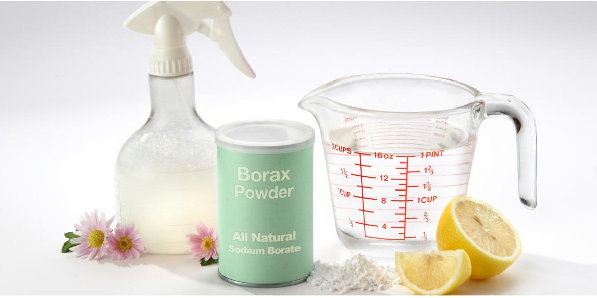 pot of borax with lemon and spray bottle used for stripping laundry