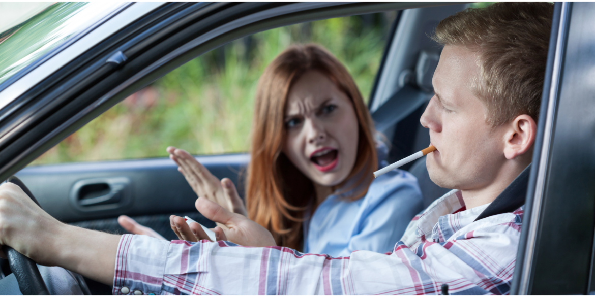 woman arguing with man smoking in car